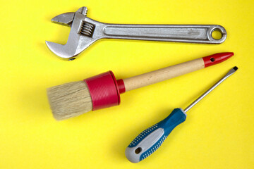 tools kit detail close up yellow background