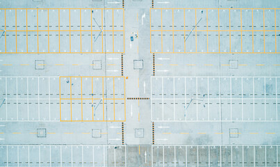 Aerial top down shot of an empty car parking lot