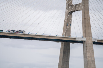 Car transport truck passing on Vasco da Gama bridge in Lisbon, Portugal