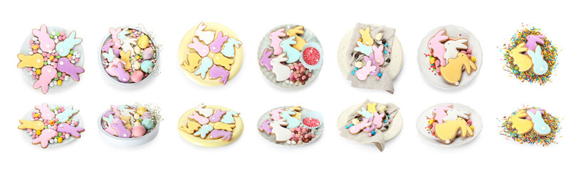 Delicious Easter cookies in shape of bunny with candies and sprinkles on white background