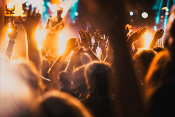 crowd with raised hands at concert - summer music festival - obrazy, fototapety, plakaty