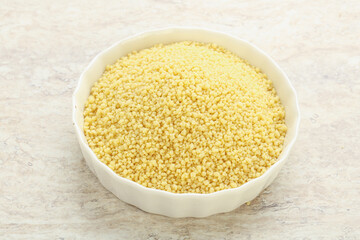Raw couscous in the bowl