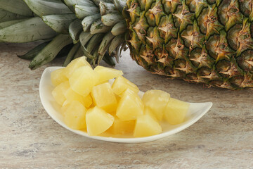 Marinated pineapple slices in the bowl
