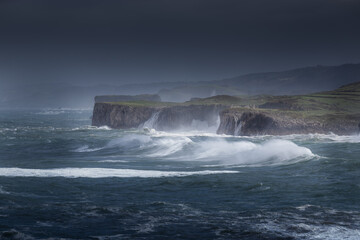 waves crashing on rocks