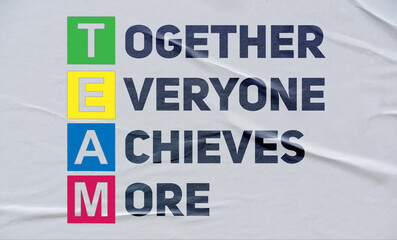 together everyone achieves more (TEAM), written on white paper