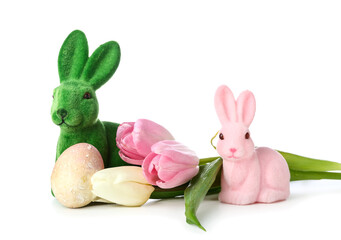 Beautiful Easter bunnies, tulip flowers and painted egg on white background