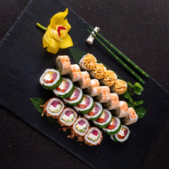 tasty sushi on the black stone