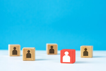 wooden cubes with the image of people stand at a distance from each other
