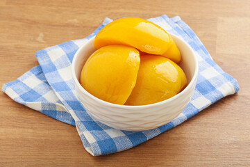 Sweet canned peaches with syrope