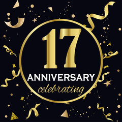 Fototapeta premium Anniversary celebration decoration. Golden number 17 with confetti, glitters and streamer ribbons on black background. 