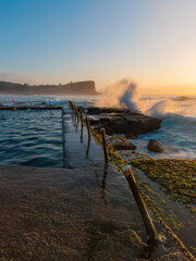 Wave crashed on the side of rock pool at Avalon Beach, Sydney, Australia.