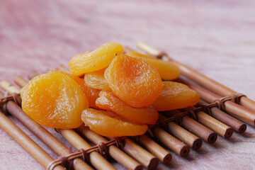Apricot fruit half on wooden board on table 