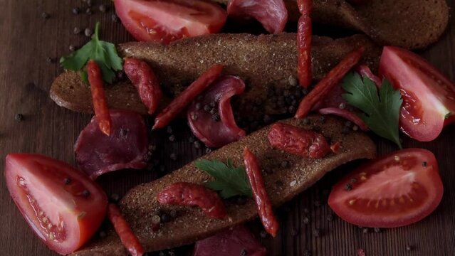 Different varieties of sausages and chips from rye bread, a table for a beer party, relaxation, banner, copy space