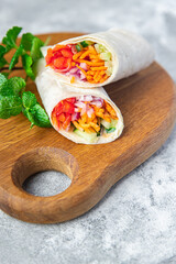 vegetarian doner kebab vegetable lavash sandwich shawarma burrito pita filling veggie vegetables on the table meal snack copy space food background 