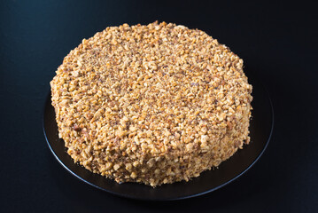 Round homemade cake with fresh hazelnuts