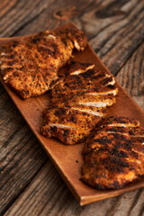Fried chicken breast on a wooden board