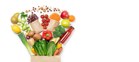 Healthy food background. Healthy food in paper bag vegetables and fruits on white, vegetarian eating. Food delivery, shopping food supermarket concept