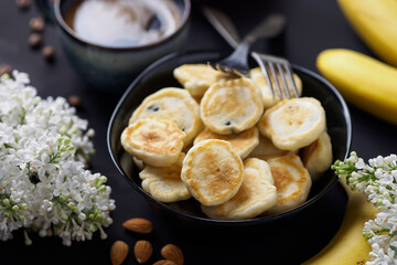 spring breakfast, banana mini pancakes with a cup of coffee