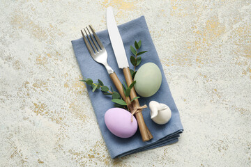 Stylish table setting for Easter celebration on light background, top view
