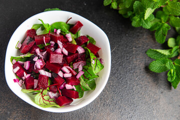 beet salad beetroot, green leaves lettuce fresh dietary healthy meal food diet snack on the table copy space food background 