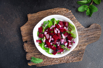 beet salad beetroot, green leaves lettuce fresh dietary healthy meal food diet snack on the table copy space food background 