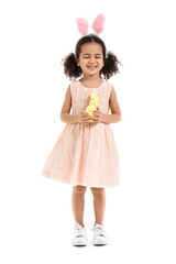 Little African-American girl in bunny ears with Easter rabbit on white background