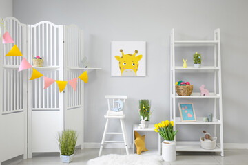 Interior of stylish children's room decorated for Easter celebration