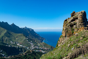 Fototapeta na wymiar Panoramic view on green mountains and blue Atlantic ocean, Anaga national park near Tanagana village, North of Tenerife, Canary islands, Spain