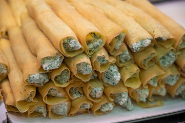Italian food, fresh home made stuffed pancakes with ricotta cheese and spinach ready to cook, Parma, Emilia Romagna, Italy