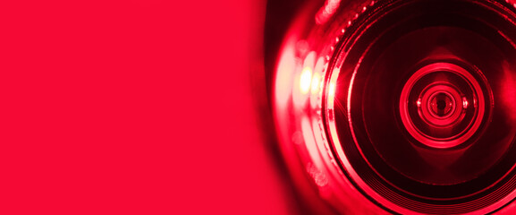 .Camera lens with red backlight. Banner