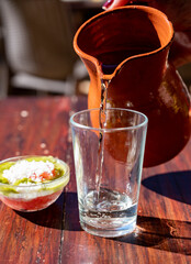 Dinner at guachinche, typical Canary Island establishment on Tenerife, where locally produced white or red wine served accompanied by homemade traditional food.
