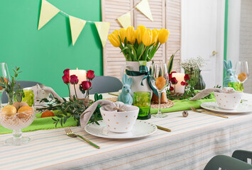 Dinnerware and floral decor on table served for Easter celebration