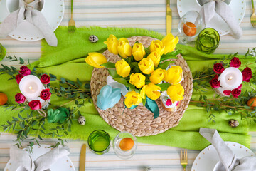 Beautiful floral decor and candles on table served for Easter celebration
