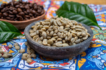 Green and roasted coffee beans from South America coffee producing region, from Colombia and Brazil with  mountain ranges and climate ideal for coffee growing