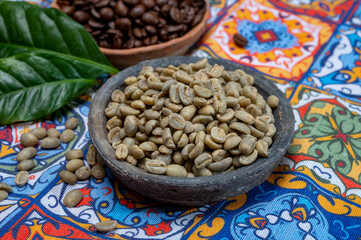 Green and roasted coffee beans from South America coffee producing region, from Colombia and Brazil with  mountain ranges and climate ideal for coffee growing