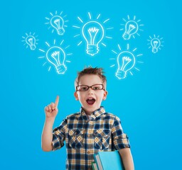 Smart kid nerd child with light bulb have good idea. Happy student
