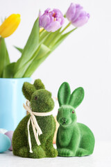 Green Easter bunnies on light background