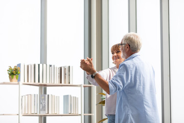 Fototapeta premium senior couple, elderly man and woman dancing together at home