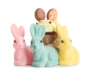 Cute Easter bunnies and tasty cake on white background