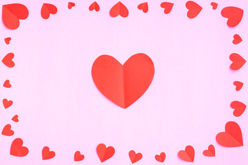 Red hearts papercut on pink background