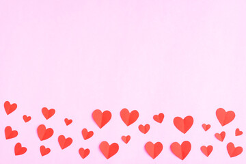 Red hearts papercut on pink background