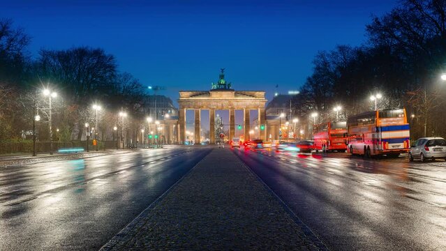 Night Time Lapse of traffic at brandenburg gate in christmas season with christmas tree, Berlin, Germany
