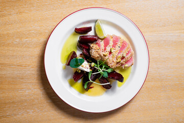 Tuna with beetroot. Seafood dish with vegetables.