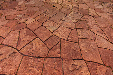 Mosaic background from red flat pavement stones