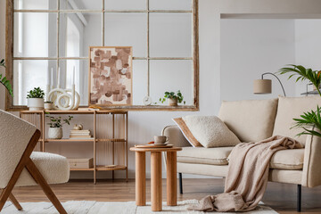 Stylish compositon of modern living room interior with beige sofa, abstract painting, wooden commode, side table and elegant home accessories. Home staging. Template. Copy space.