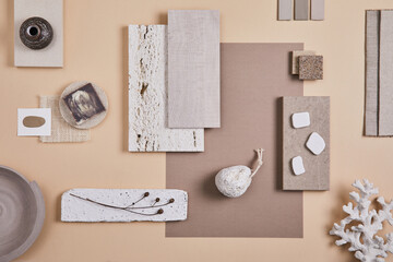 Creative interior designer moodboard. Flat lay composition with textile and paint samples, panels and cement tiles. Beige and grey color palette. Copy space. Template.
