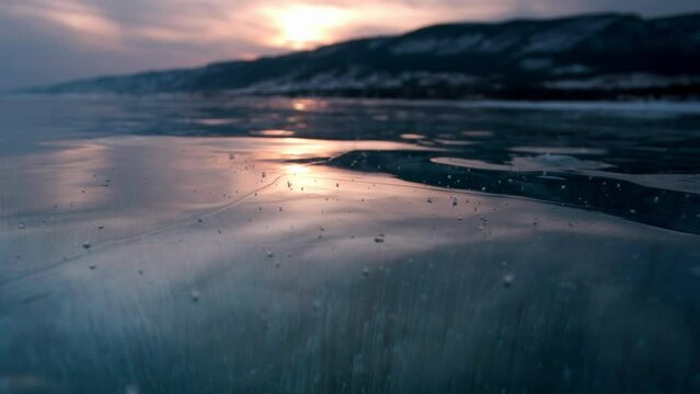Time-lapse, sunset on an icy lake