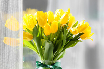 Bouquet of beautiful tulip flowers near window, closeup