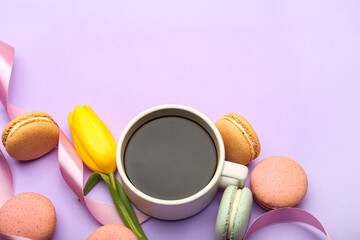 Obraz na płótnie Canvas Cup of coffee, sweet macaroons and tulip flower on lilac background. International Women's Day celebration