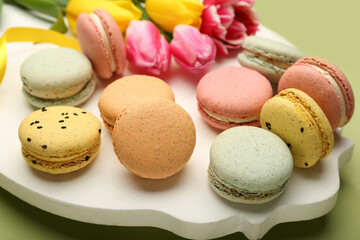 Board with sweet macaroons, closeup